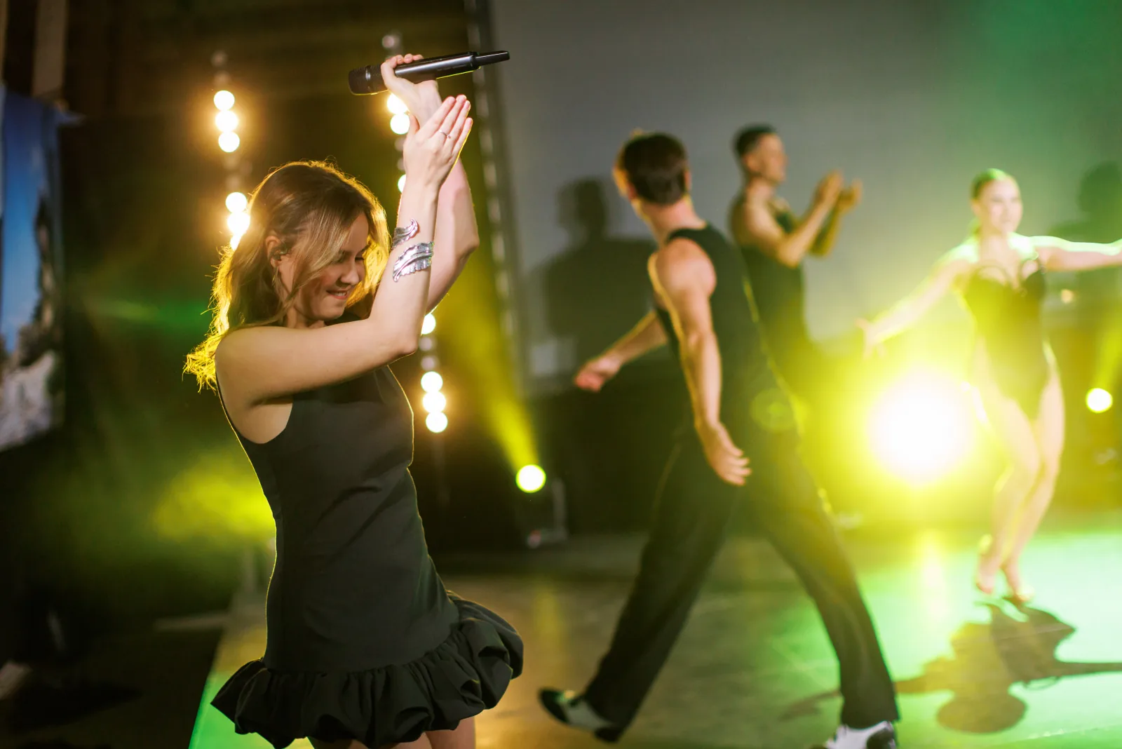 Professional dancers and vocalist performing at a corporate event