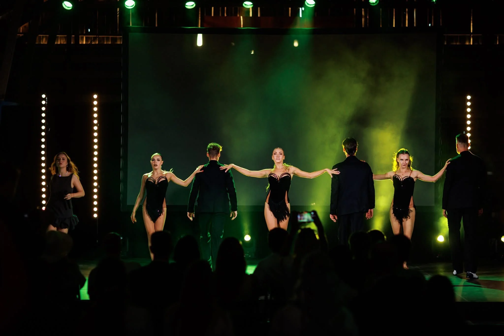 Ensemble dance show performing on stage